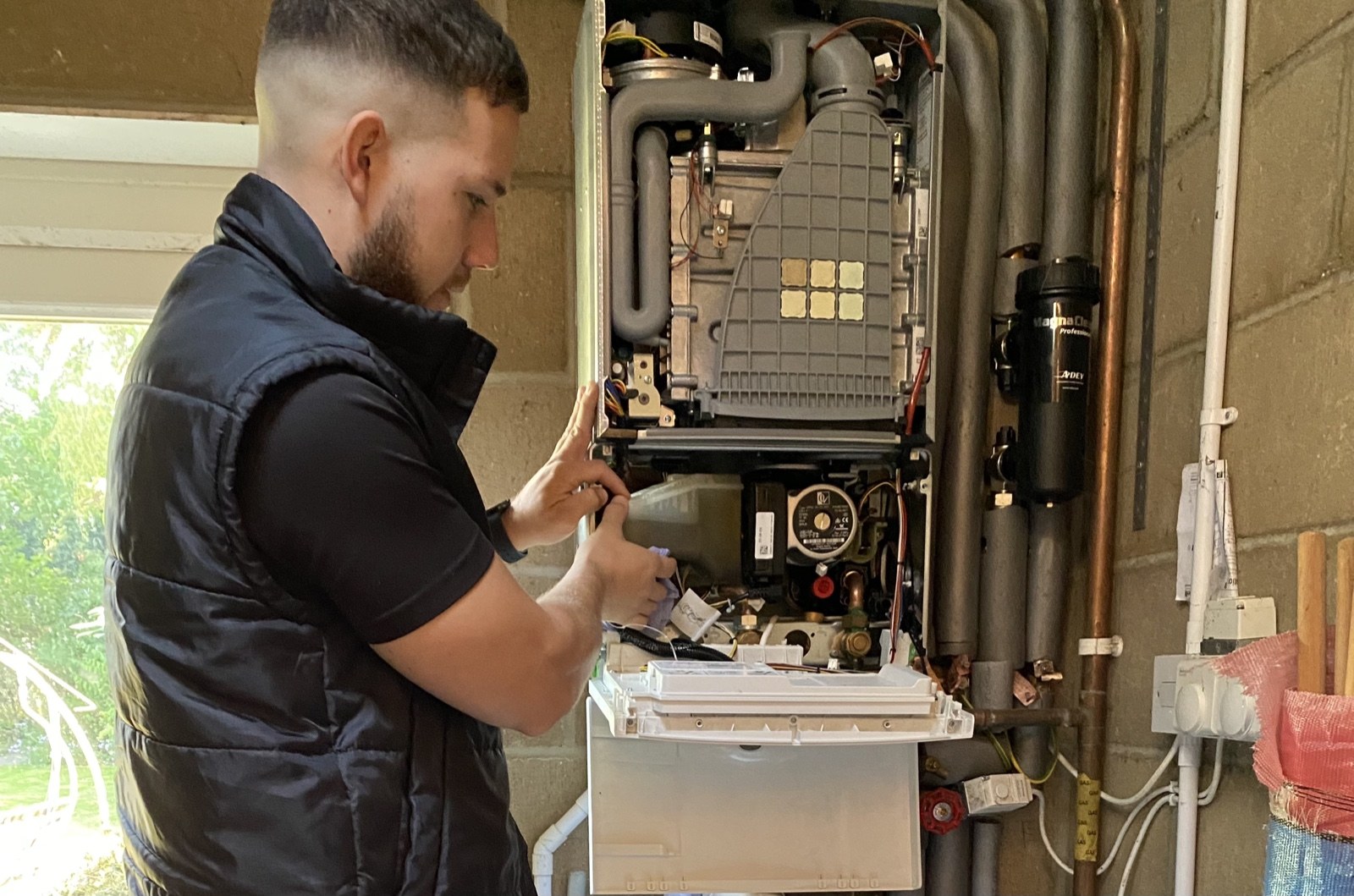 Precision engineer servicing a boiler